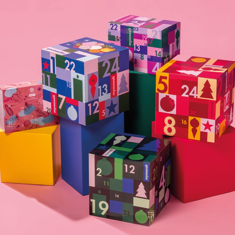 coffret gourmand coloré calendriers de l'avent mymuesli 2024 avec muesli, chocolat, thé, snack