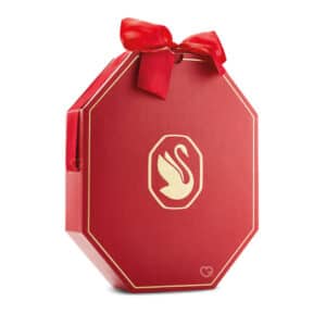 Calendrier de l'Avent Swarovski 2024 dans un coffret rouge avec un noeud