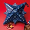 coffret illustré forme flocon Calendrier de l'Avent La Maison du Chocolat 2024 contenant 26 chocolats et douceurs chocolatées
