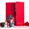 contenu complet du coffret luxe rouge calendrier de l'Avent vogue 2024 contenant 25 produits de beauté multimarque pour visage, corps, maquillage